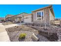 Well-manicured front yard with tasteful xeriscaping enhancing this home's curb appeal at 8829 Animas River St, Littleton, CO 80125