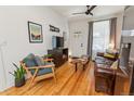 Inviting living room featuring hardwood floors, exposed brick, and comfortable seating at 3329 N High St, Denver, CO 80205