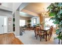 Bright dining room with hardwood floors and a chandelier at 6515 S Killarney Ct, Aurora, CO 80016