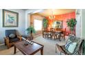 Spacious dining area with a large table and accent wall at 6515 S Killarney Ct, Aurora, CO 80016