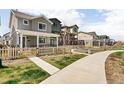 Inviting neighborhood street with well-maintained homes and sidewalks, ideal for strolling and enjoying the outdoors at 320 Marshall Mews, Superior, CO 80027