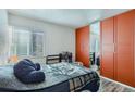 Comfortable bedroom with large mirrored closet and ample natural light at 940 S Peoria St, Aurora, CO 80012