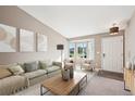 Bright living room featuring neutral tones, bay window, and contemporary decor at 2905 E Yarrow Cir, Superior, CO 80027