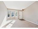 Bright living room with bay window and neutral carpet at 2905 E Yarrow Cir, Superior, CO 80027