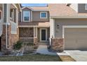 Welcoming front entrance showcasing brick accents and well-maintained landscaping at 7700 W Grant Ranch Blvd # 7C, Littleton, CO 80123