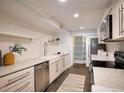 Modern kitchen featuring white cabinets and quartz countertops at 99 S Downing St # B2, Denver, CO 80209