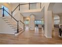 Grand entrance featuring hardwood floors and an open floor plan to the living room at 6393 S Richfield St, Aurora, CO 80016