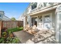 Charming front porch with two Adirondack chairs, perfect for relaxing outdoors at 8738 Chase Dr # 133, Arvada, CO 80003
