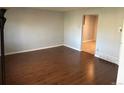 Spacious living room features hardwood floors and neutral paint at 4505 Everett St, Wheat Ridge, CO 80033