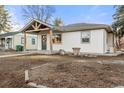 Quaint home with a covered porch, neat landscaping and a freshly painted exterior at 3287 S Humboldt St, Englewood, CO 80113