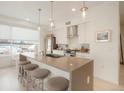 Modern kitchen with stainless steel appliances and an island with seating at 1616 S Broadway # 217, Denver, CO 80210