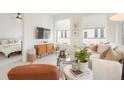 Living room with an open floor plan, showing a glimpse of the bedroom at 1616 S Broadway # 217, Denver, CO 80210