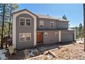 Well-maintained home with attached garage and a charming front entrance at 6904 Sprucedale Pkwy, Evergreen, CO 80439