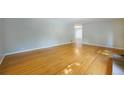 Spacious living room featuring lustrous hardwood floors, neutral paint, and natural light at 291 Magnolia St, Denver, CO 80220