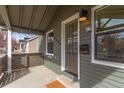 Covered porch area featuring a mail slot, light fixture and room to relax at 2200 Fenton St, Edgewater, CO 80214