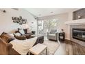 Cozy living room featuring a modern fireplace, comfortable seating, and a bright, airy atmosphere at 7409 S Alkire St # 304, Littleton, CO 80127