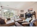 Bright and inviting living room with a fireplace, sliding glass doors, and stylish decor at 7409 S Alkire St # 304, Littleton, CO 80127