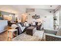 Comfortable living room with modern decor, plush seating, and plenty of natural light at 7409 S Alkire St # 304, Littleton, CO 80127