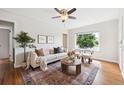 Bright living room with hardwood floors and a decorative rug at 1100 S Garfield St, Denver, CO 80210