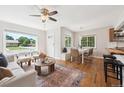 Open-concept layout with hardwood floors and views of front yard at 1100 S Garfield St, Denver, CO 80210