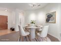Bright dining room with stylish round table and chairs, perfect for intimate meals at 13456 Via Varra # 224, Broomfield, CO 80020