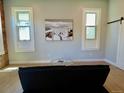 Inviting living room with exposed brick, beach art, and modern furniture at 2737 N Marion St, Denver, CO 80205