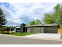 Charming single-story home with modern black trim, carport, fresh grass and new concrete driveway at 290 Beryl Way, Broomfield, CO 80020
