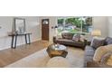 Bright living room with modern sofas, stylish decorations, and lots of natural light at 3384 W Arlington Ave, Littleton, CO 80123