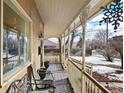 Inviting front porch with ornate railings and comfy seating at 3039 W 22Nd Ave, Denver, CO 80211