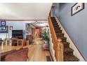 Spacious living room with hardwood floors and a view of the staircase at 3039 W 22Nd Ave, Denver, CO 80211