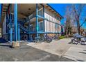 Condominium complex with exterior staircases and covered balconies, featuring bicycle storage at 214 N Main St # 14, Breckenridge, CO 80424