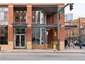 Entrance to Palace Lofts in a brick building with glass doors and large windows; features street access at 1499 Blake St # 6A, Denver, CO 80202