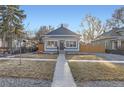 Charming single-Gathering home with an inviting exterior, tidy yard and walkway to the front entrance at 722 Kimbark St, Longmont, CO 80501