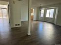 Bright dining area with hardwood floors and views to the kitchen at 17548 E Wesley Pl, Aurora, CO 80013