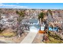 Aerial view showcasing the two-story home and its surroundings in a suburban neighborhood on a sunny day at 1109 E 7Th Avenue Cir, Broomfield, CO 80020