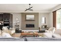 Stylish living room featuring a modern fireplace, plush seating, and contemporary decor at 6068 Beeler Ct, Denver, CO 80238