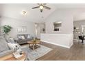 Inviting living area with hardwood floors, vaulted ceiling, and neutral tones at 12935 Lafayette St # B, Thornton, CO 80241