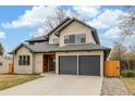 Charming two-story home with a stone and stucco exterior, gray roof, dark garage doors and driveway at 3350 S Eudora St, Denver, CO 80222