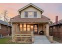 Attractive craftsman home, featuring a covered porch and landscaped yard at 4415 N Clay St, Denver, CO 80211