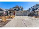 Beautiful two-story house with a spacious driveway and well-manicured front yard at 4104 N Picadilly Ct, Aurora, CO 80019