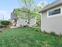Well-maintained backyard with green lawn, patio and two-story home in background at 208 N Foote Ave, Lafayette, CO 80026