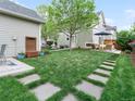Spacious backyard with lush lawn and patio area perfect for outdoor entertaining at 208 N Foote Ave, Lafayette, CO 80026
