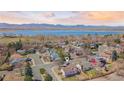 Breathtaking aerial shot of the home's location near a beautiful lake and the mountains at 8900 Iris Ct, Broomfield, CO 80021