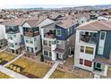 Birds eye view of a modern home with balcony and nearby neighborhood at 5738 Urban Ctr, Arvada, CO 80002