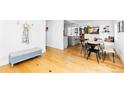 Bright dining room featuring hardwood floors, natural light and adjacent kitchen space at 2520 S Race St, Denver, CO 80210