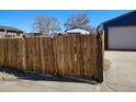 Newly constructed wooden fence ensuring privacy and security for the property at 15003 Olmsted Dr, Denver, CO 80239