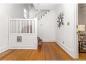Bright entryway featuring beautiful hardwood floors, staircase, and decorative mirror adding a touch of elegance at 1723 E 16Th Ave, Denver, CO 80218
