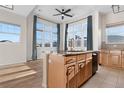 Bright kitchen boasts a large island, ample natural light, and modern finishes at 15455 Canyon Rim Dr # 307, Englewood, CO 80112