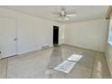 Bright living room featuring neutral walls, tile floors and a ceiling fan at 200 Perry St, Denver, CO 80219