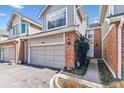 Charming townhome featuring a well-manicured lawn and an attached one car garage at 7696 S Monaco E Cir, Centennial, CO 80112